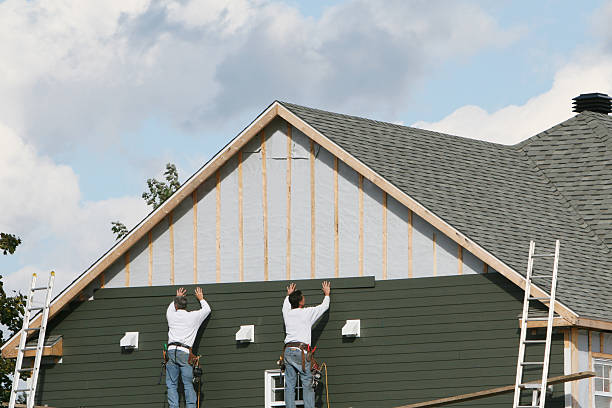 Professional Emergency Siding Repair technician working in Chester, WV